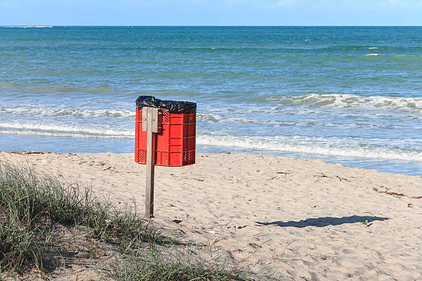 istock Trash can on the beach sunny day. 540220862