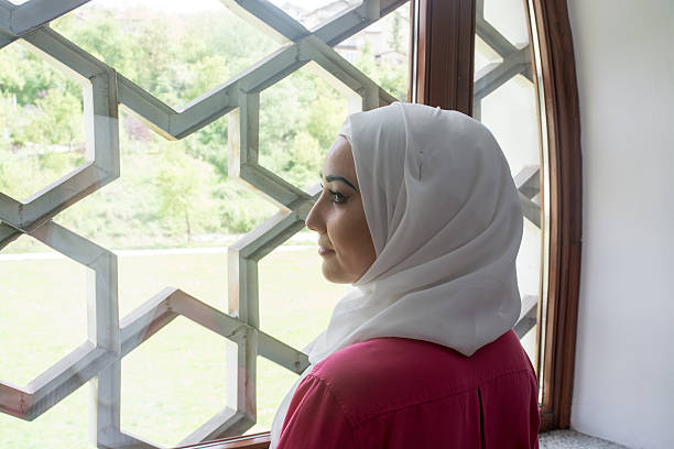 istock Young muslim woman in mosque praying 540223596
