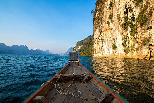 istock Head boat and big mountain in the sea. 540223704