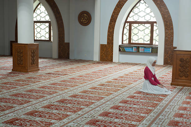istock Young muslim woman in mosque praying 540225764