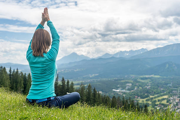 istock Woman Meditate at the Mountains 540226884