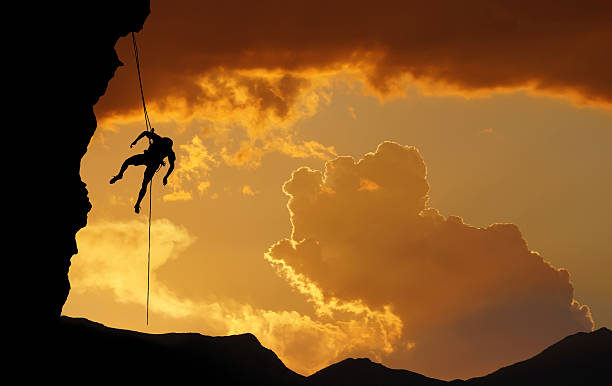 istock Silhouette of Rock Climber at Sunset 540232454