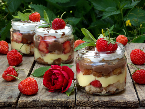 Italian traditional dessert of strawberries, sponge cake, custard and meringue \