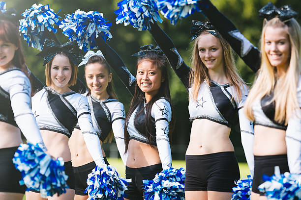 istock Cheerleader group with pom-pom together 540233490