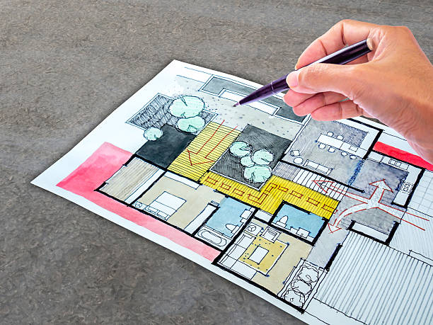 istock Designer's hand working with home floor plan/ Real estate business 540233720