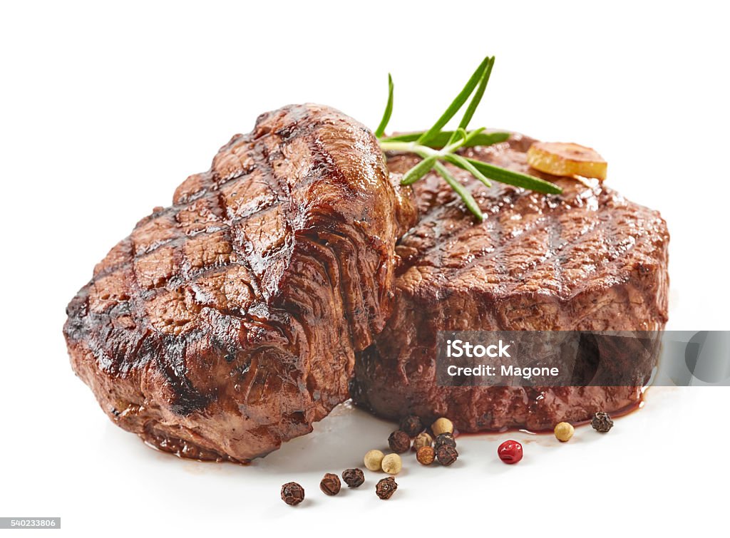 grilled beef steaks grilled beef steaks with spices isolated on white background Steak Stock Photo