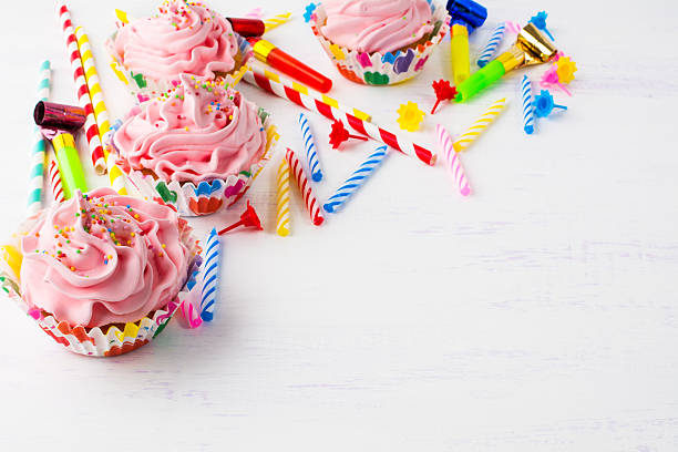 istock Birthday background with pink cupcakes 540234594