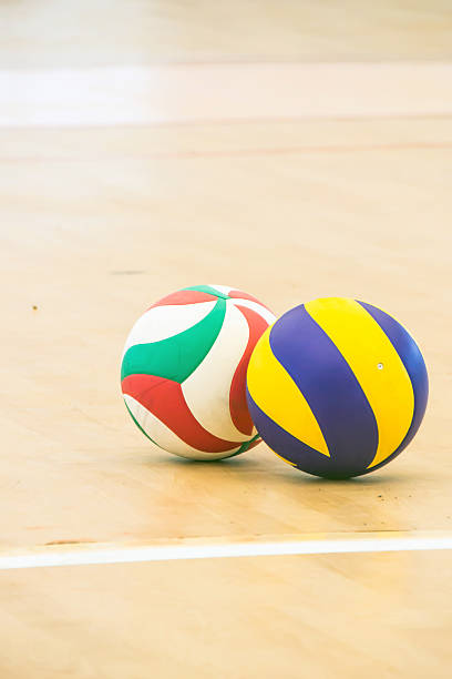 istock Blue and yellow volleyball on ground Volleyball 540234876