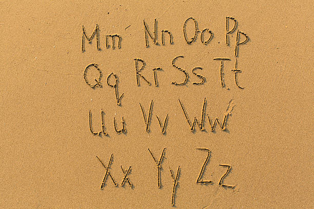 istock Alphabet letters drawn on beach sand (M-Z, 2/2) 540236494