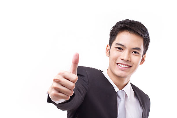istock successful businessman giving thumb up, with text space 540236598