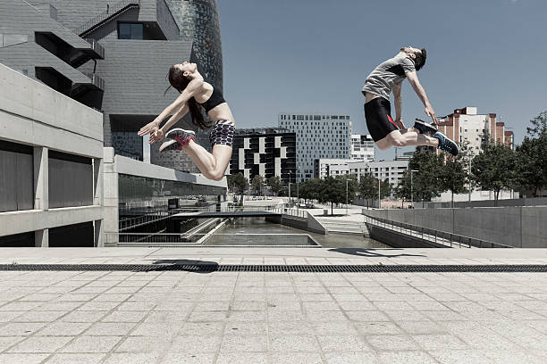istock Man and woman jumping 540238576