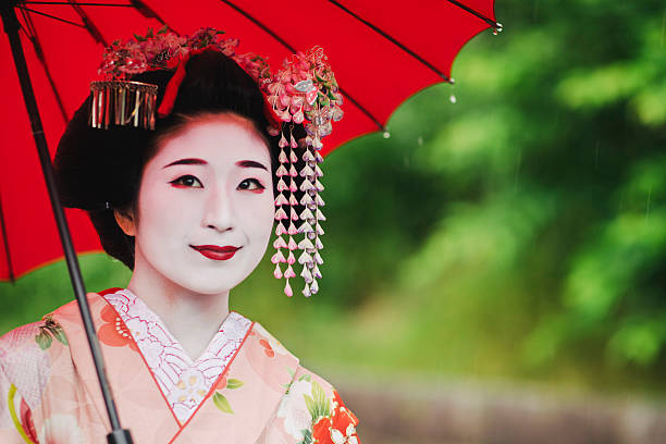 istock Maiko lady with parasol in the rain 540239464
