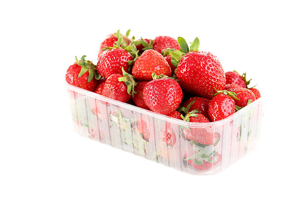 Strawberries in basket isolated on a white