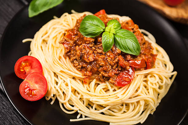 istock Spaghetti bolognese on dark background 540361954