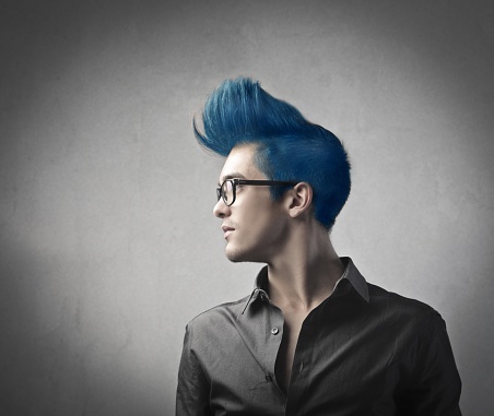 Smart man with glasses and blue hair 