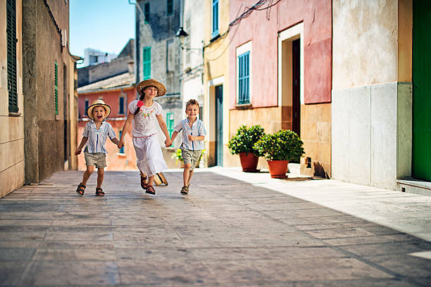 istock Kids running in beautiful mediterranean town. 540363452