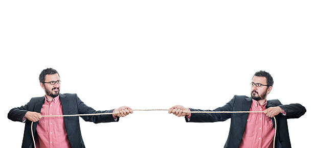 istock Two businessmen playing tug of war 540364466
