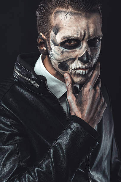 istock Portrait of pensive man with make-up  skull 540364962