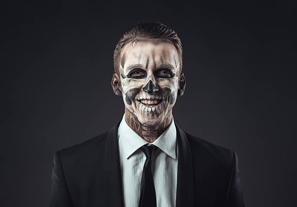 istock Portrait laughing businessman with makeup skeleton 540365080