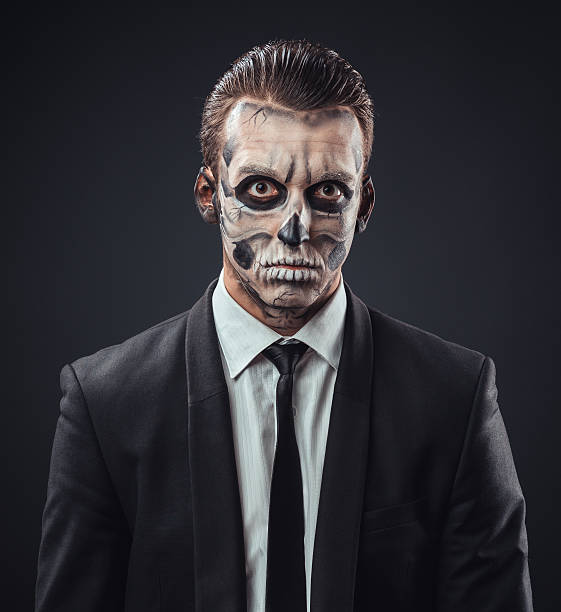 istock blunt businessman with makeup skeleton 540366092