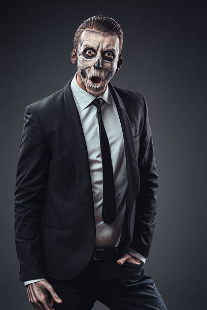 istock Surprised businessman with a makeup  skeleton 540366698