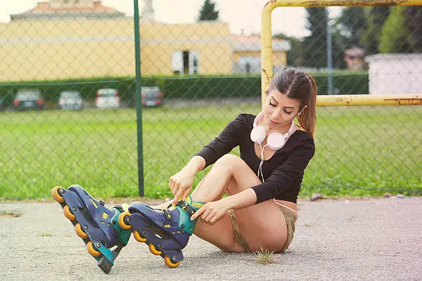 Young woman on rollerblades