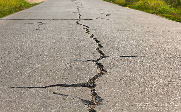 istock Surface of concrete driveway with crack 540367762