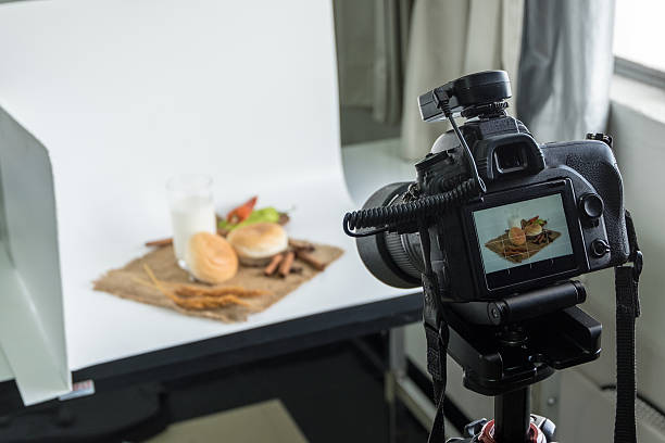 Camera shooting bread and glass of milk in indoor studio DSLR camera to shooting bread and glass of milk in  indoor photo studio lightbox photos stock pictures, royalty-free photos & images