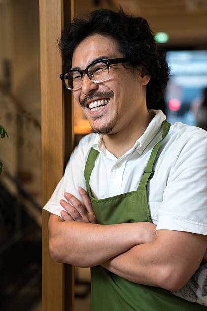 istock Small business cafe owner greeting customers 540369418