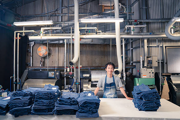 istock textile industry worker counting garments before shipping 540369568