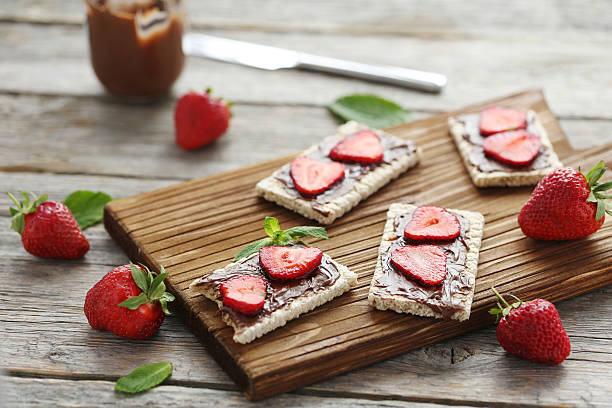 istock Breads with chocolate and strawberry on wooden table 540369950