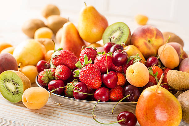 istock Fresh mixed fruits, berries on plate. Summer fruit, berry. 540370920
