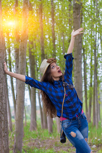 istock beautiful girl with a telescope in the forest 540371142