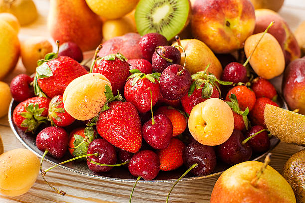 istock Fresh mixed fruits, berries on plate. Summer fruit, berry. 540371150