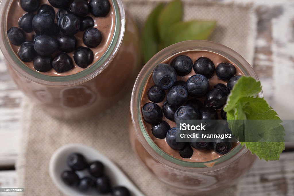 morning snack with chia seeds chocolate pudding and blueberries Healthy breakfast or morning snack with chia seeds chocolate pudding and blueberries. vegetarian food, diet and health concept. Antioxidant Stock Photo