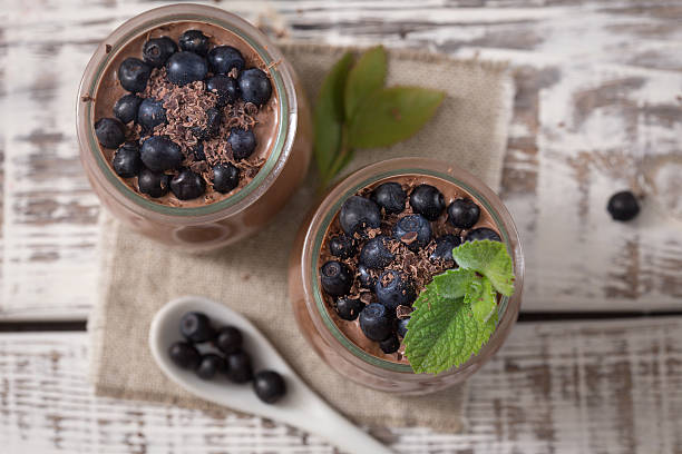 morning snack with chia seeds chocolate pudding and blueberries stock photo
