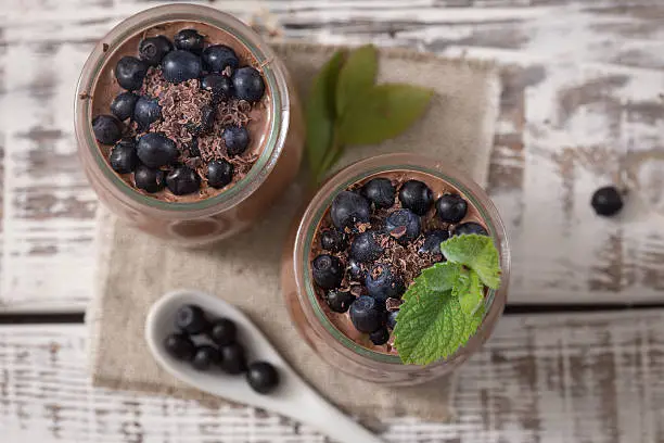 Photo of morning snack with chia seeds chocolate pudding and blueberries