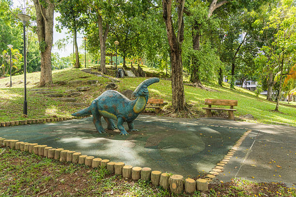 Singapore, Singapore - June 12, 2016: The representation of a hadrosaurus is used as a climber in the dinosaur themed playground of a Housing and Development Board neighborhood in Woodlands, Singapore. The image was taken in the afternoon. 