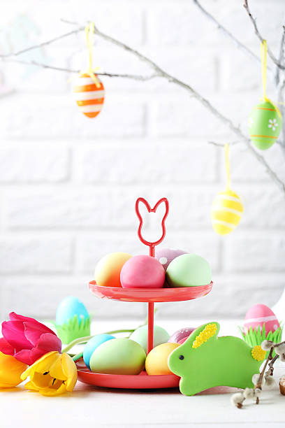 istock Easter eggs with cookies on a white wooden table 540373560