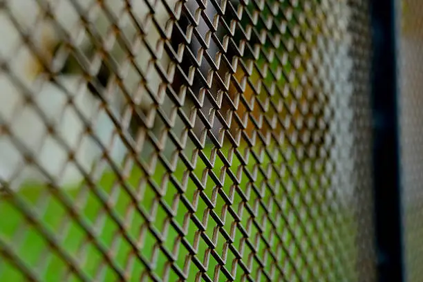 Photo of Steel mesh background (Selective focus)