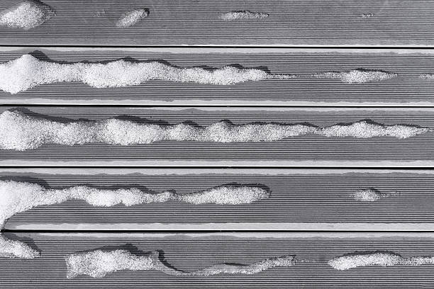 istock Snow melts in the spring striped boards 540375922