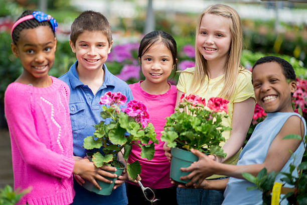 istock Children Holding Flowers 540376156