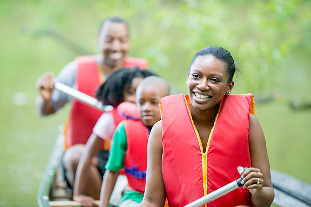 istock Family on a Canoe Trip 540376330