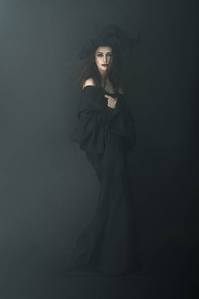 istock slender witch in a dark fog 540377984