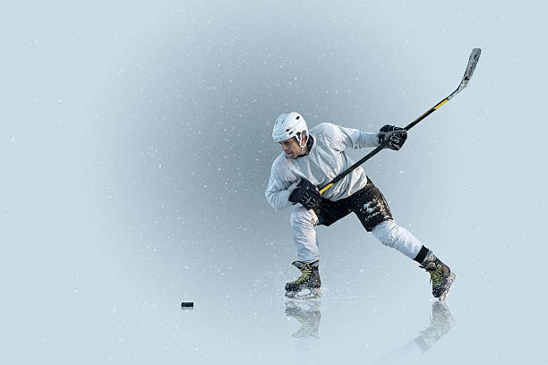 istock Ice hockey player on the ice and light effects 540381514