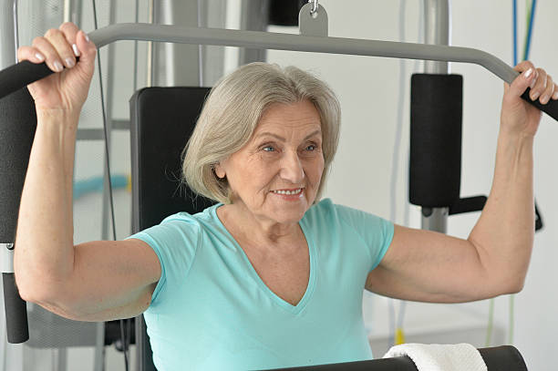 istock smiling senior in gym 540381552