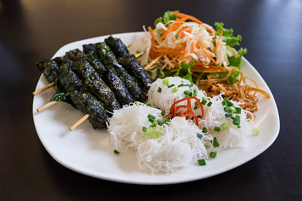 istock Grilled pork wrapped in betel leaf, Vietnamese cuisine 540383066