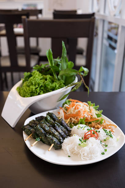 istock Grilled pork wrapped in betel leaf, Vietnamese cuisine 540383248
