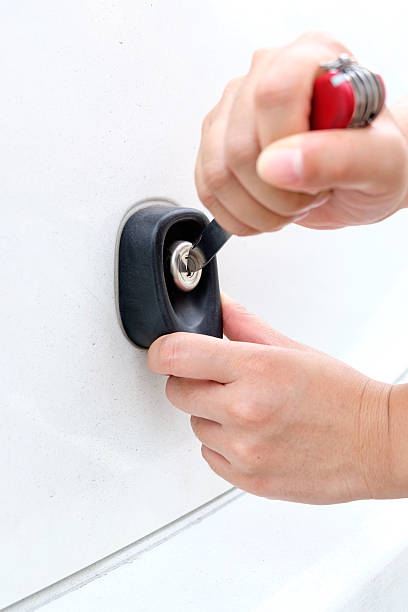istock hand of Thief using knife try to opening Car Door 540383804