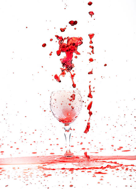 istock red wine splash in the glass on white background 540386724